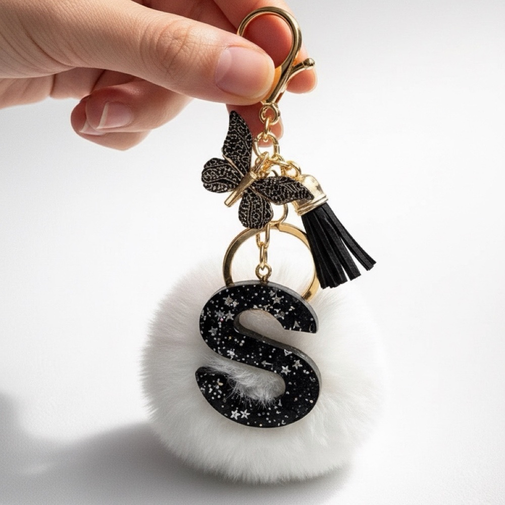 Personalized 'S' White Fur Pom Keychain with Black Accents